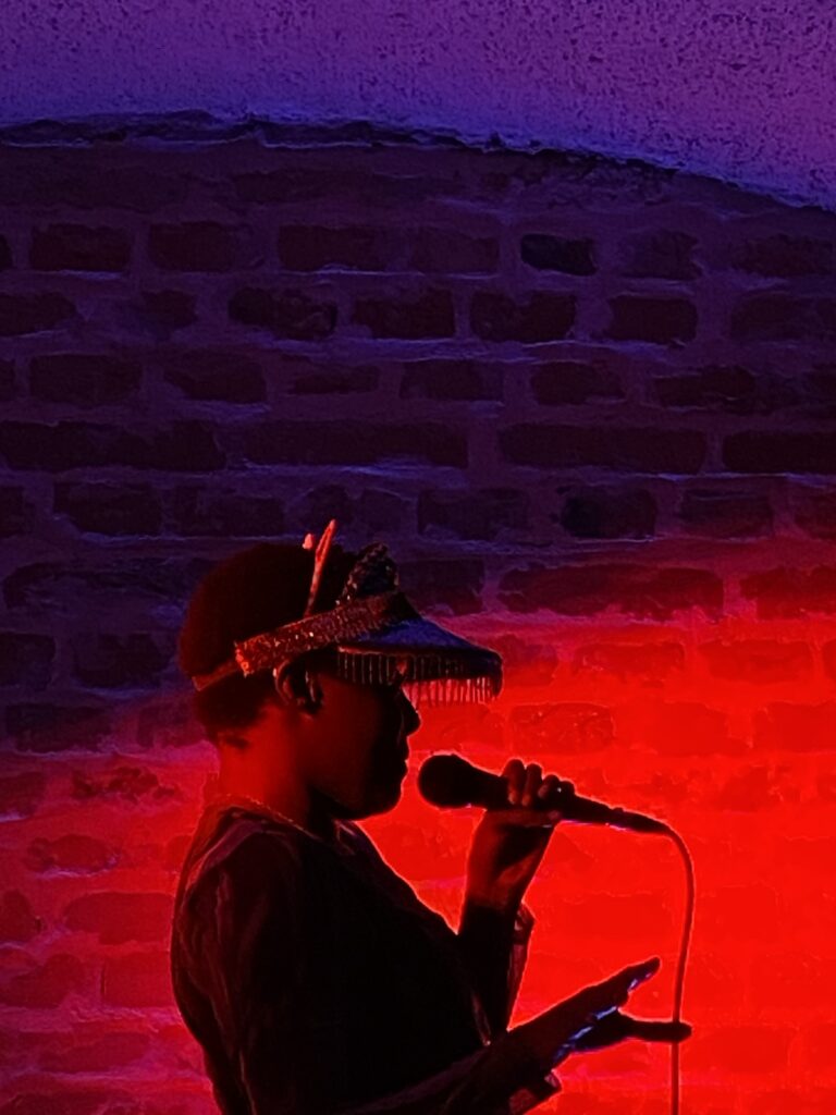 CYON FLEX performing on stage under red light